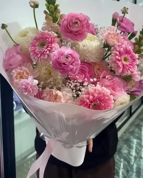 Soft pink ranunculus in blush wrap